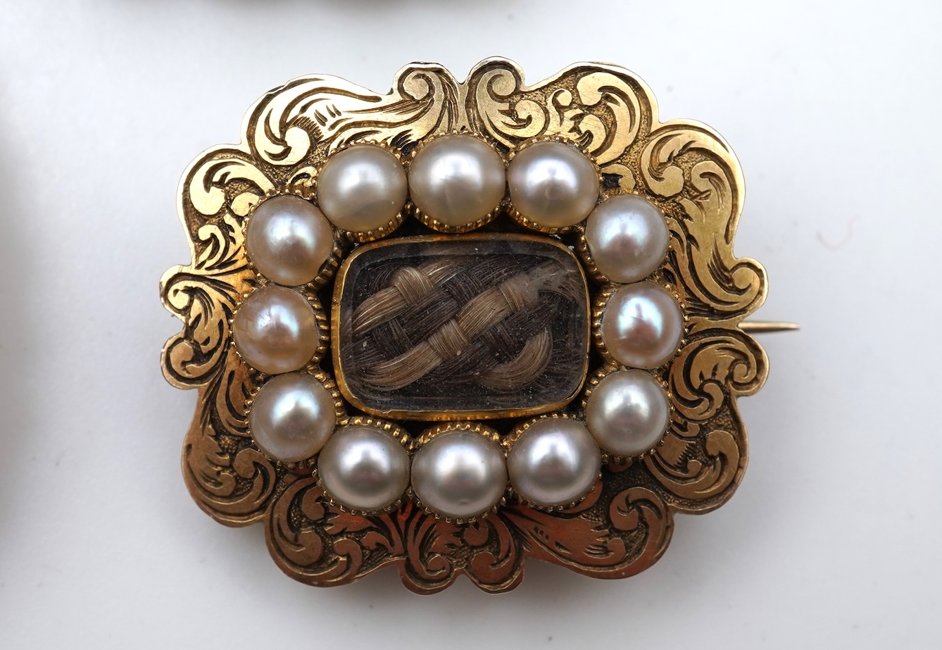 A collection of five Georgian/Victorian brooches, circa 1800-1900